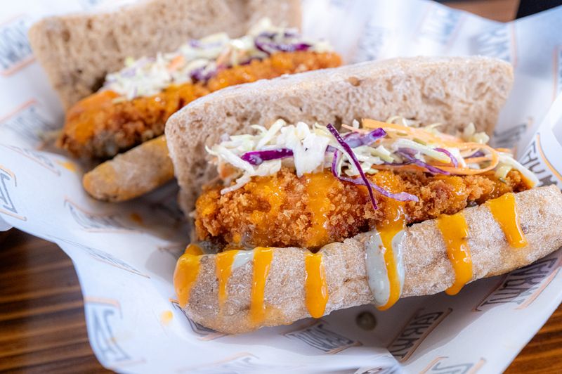 hangry joe's feast box with assorted hot chicken and sides