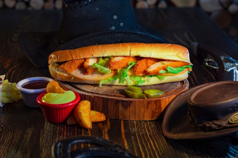 Hangry Joe's chicken and waffle stack with maple syrup
