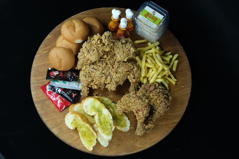 Hangry Joe's loaded hot chicken plate with sides